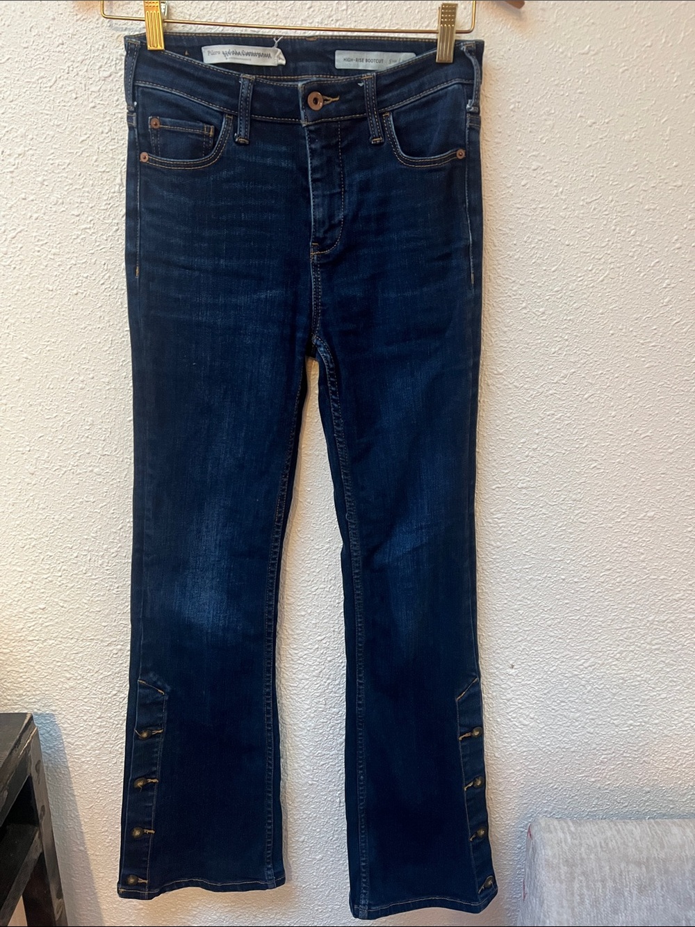 Anthropologie Dark Blue Flare Jeans with Button Hem Detail